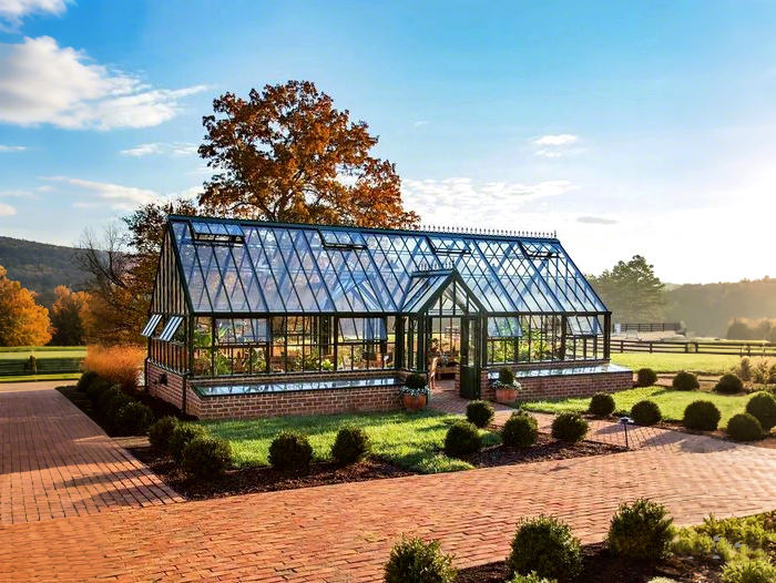 Victorian style steel and glass greenhouse for garden